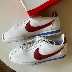 Nike White Sneakers with Red Swoosh and Blue Accent
